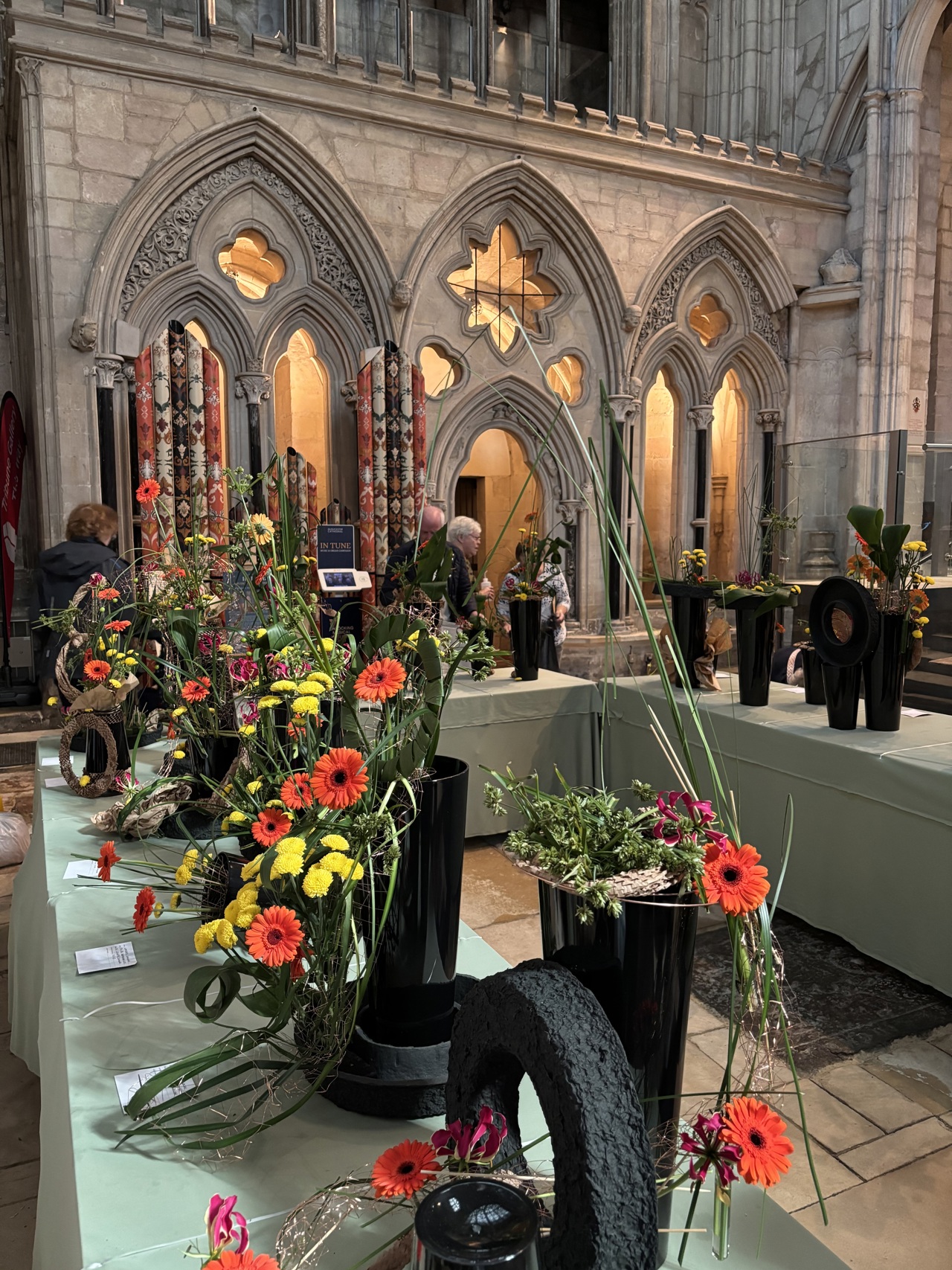 2025 Competition entries on display with red and yellow flowers